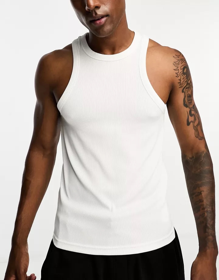Camiseta deportiva blanca sin mangas de tejido acanalad
