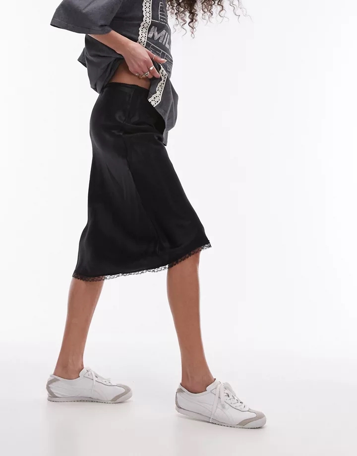 Falda midi negra estilo años 90 con cinturilla lencera 