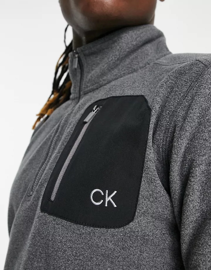 Top gris carbón con cremallera corta y bolsillo de parche de felpa Planet de Calvin Klein Golf Gris claro eSzbhiPA