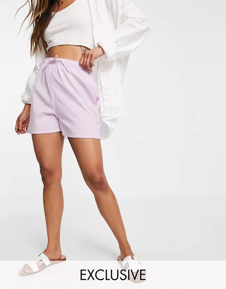 Pantalones cortos de playa lila de lino exclusivos de E