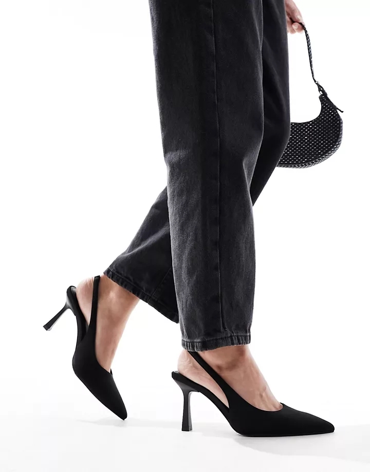 Zapatos negros de tacón medio de aguja con tira taloner